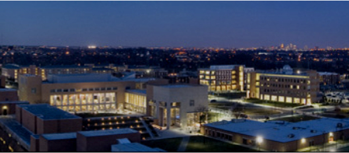 UMBC campus at night with Baltimore's skyline in the background